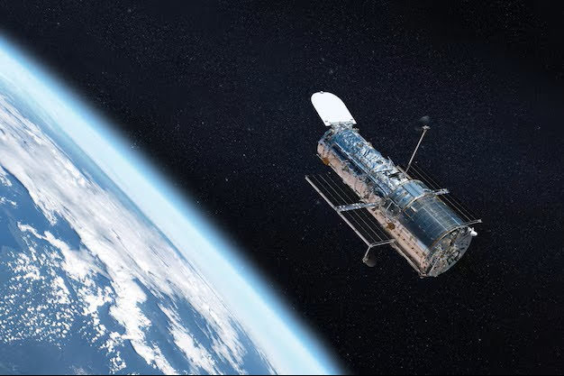 Hubble Space Telescope orbiting above Earth